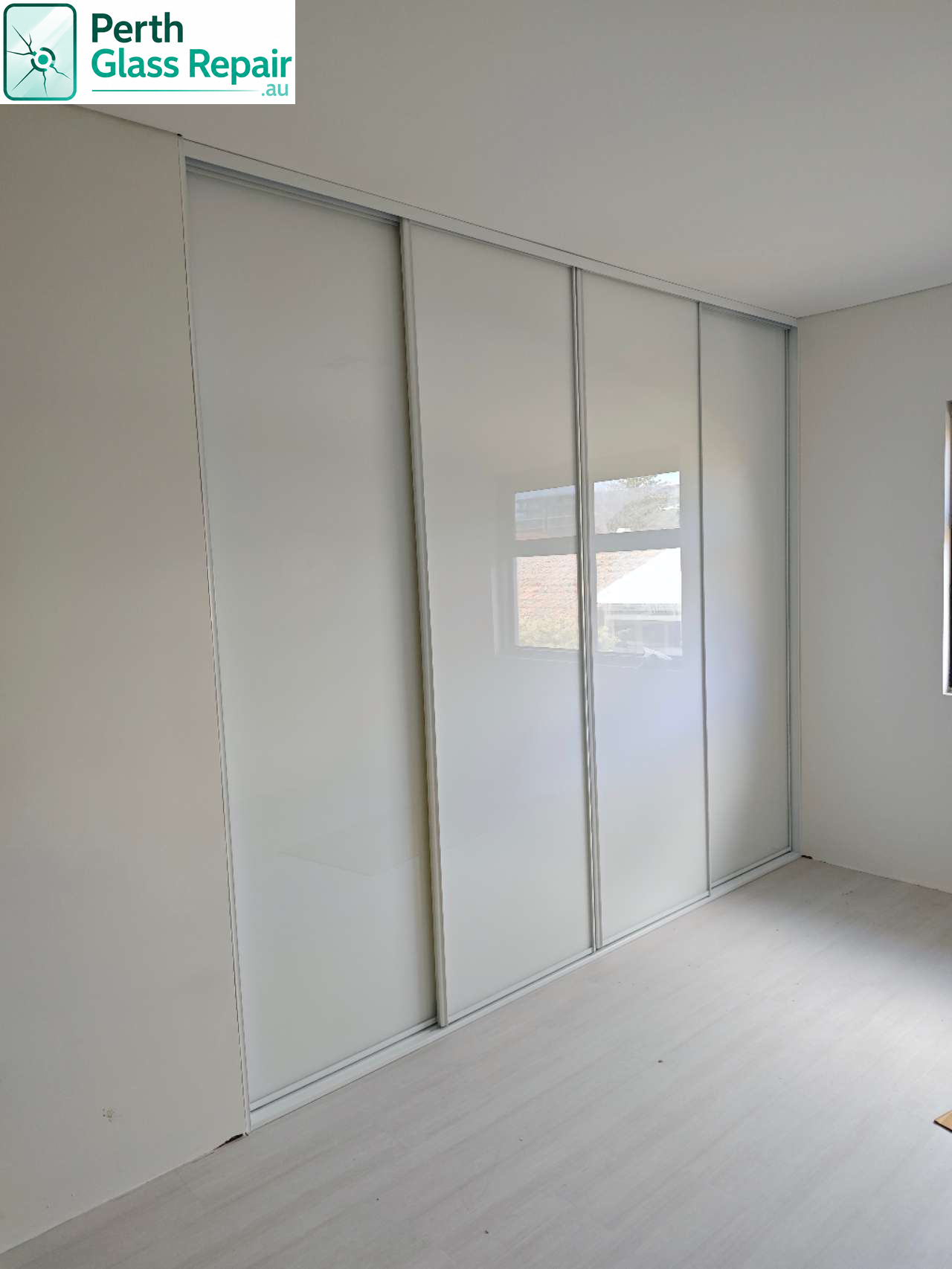 White glass wardrobe sliding doors installed by Perth Glass Repair